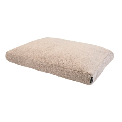 Beige orthopedisch hondenkussen teddy van pluche schapenvacht met zachte, getextureerde oppervlakte en subtiel merklabel